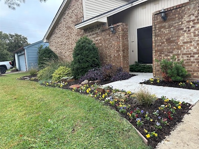 Cute flowerbed by the front door