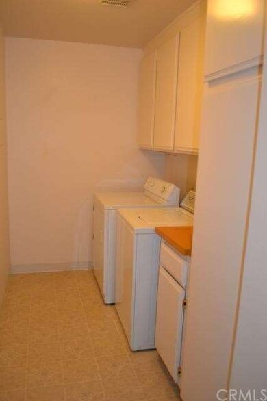 The Laundry room is large, has a folding table and