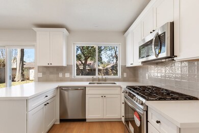 Bright kitchen with modern appliances, white cabin
