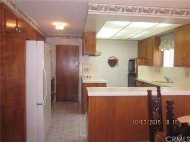 The counter top stove, microwave, oven and dishwas