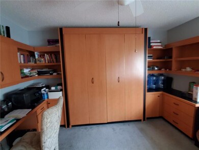 Bedroom 2 has built in Murphy bed with desk and sh