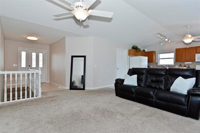 Vaulted GreatRm & Kitchen.  Lead Glass front door 