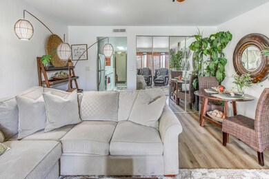 Living room with light wood-type flooring