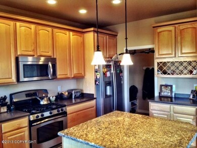 Kitchen - granite island & SS appl