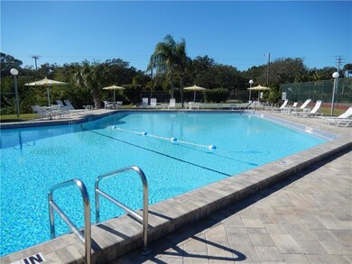 Beautifully paved community pool is heated and has