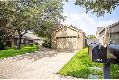 View of front of property featuring brick siding, a garage, and a front yard