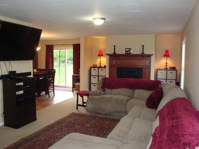 Spacious living room complete with gas fireplace.