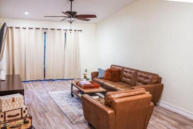 Living room featuring ceiling fan, recessed lighti