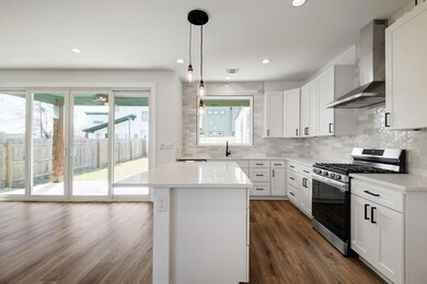 Kitchen with wall chimney range hood, decorative 