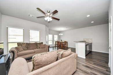 The open concept living area features large window