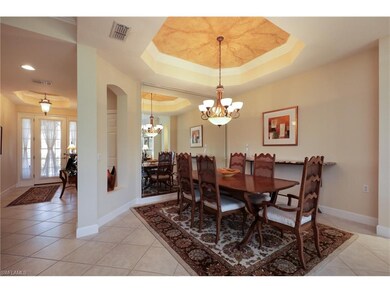 Dining room features inset ceiling.