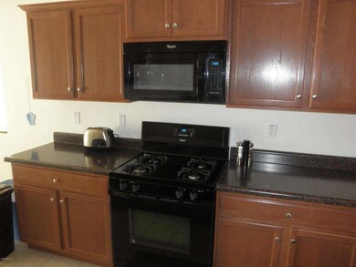KITCHEN CABINETS,STOVE,MICROWAVE