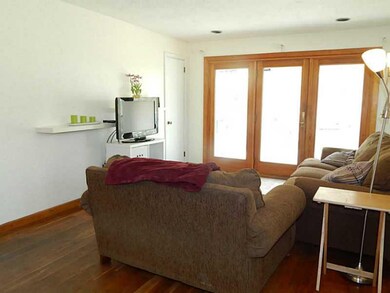 Living Room. Living area with hardwood floors, sli