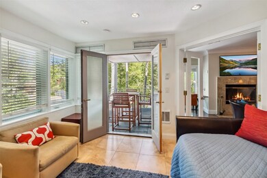 Tiled bedroom featuring access to exterior, french