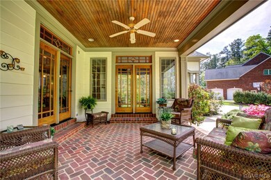 Covered lanai with brick herringboned floor and be