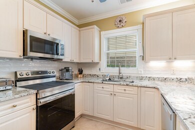 Kitchen with backsplash, sink, ornamental molding,