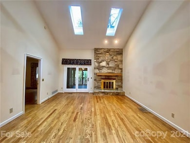 Rock Fireplace and Patio Door to Sunroom