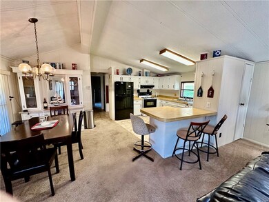 Open floor plan with vaulted ceilings.