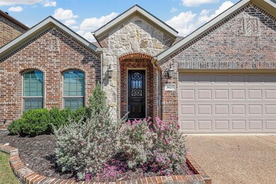 Front of property featuring a garage