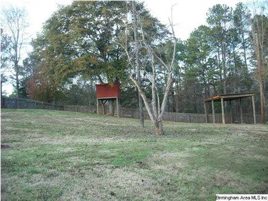 tree house and pole barn in backyard