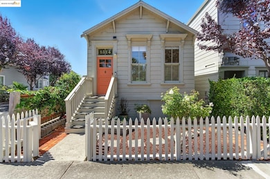 Shotgun-style home featuring a fenced front yard