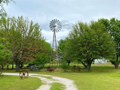 View of community featuring a yard