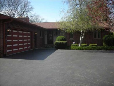 Exterior Front Circular Blacktop driveway