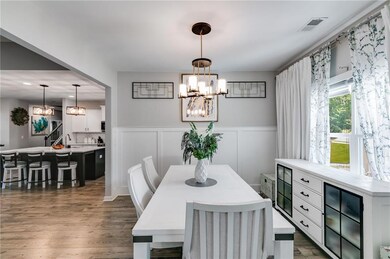 Dining room with a chandelier, wood finished floor