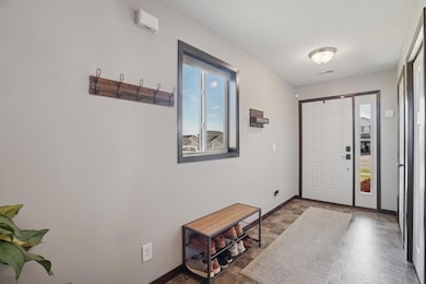Welcoming entryway with ample space for guests and a convenient coat closet for everyday storage