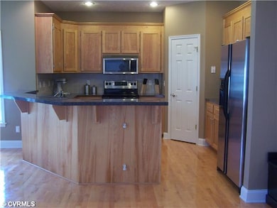 Kitchen - Lots of cabinets and large corner pantry