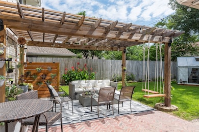 Charming backyard with a wooden pergola providing