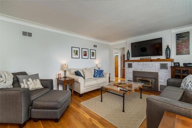 Gorgeous wood floors with crown molding and wood b