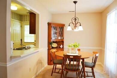 The dining room has a breakfast bar that adjoins t