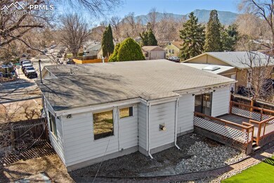 Rear view of house and a deck with mountain view