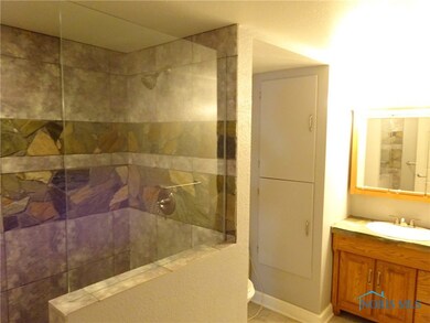 Awesome full bath in basement with stone and tile