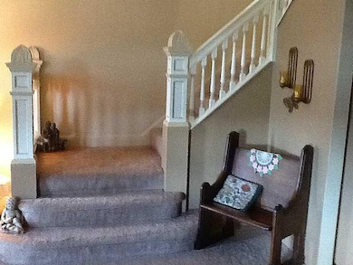 Living Room. Ornate wood banister and spindles.