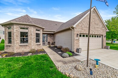 Covered porch and lovely landscaping greets your guests.