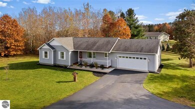 3238 Tamara Cir, Grawn, MI 49637 - photo 2