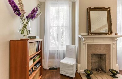 Dining room close-up.  Sheer window coverings and
