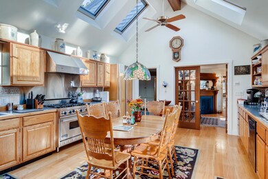 Kitchen towards den to the left and formal dining to the right