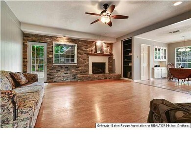 Den with beautiful Wood Burning Fireplace, opens i