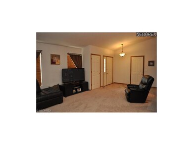 vaulted great room with coat closet and access to 