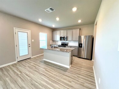 Kitchen featuring appliances with stainless steel