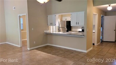 Great room with breakfast bar open to kitchen