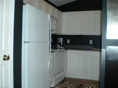 Plenty of cabinets and counter space in this efficient kitchen.