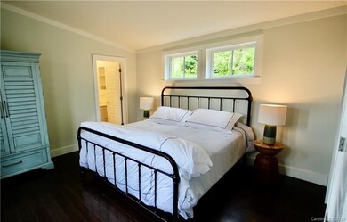 Master bedroom on main level offers access to mast