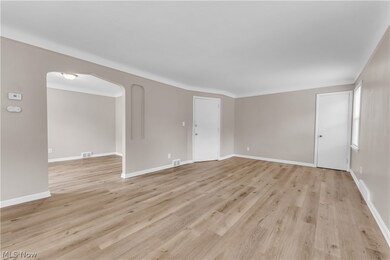 Unfurnished room with light hardwood / wood-style floors