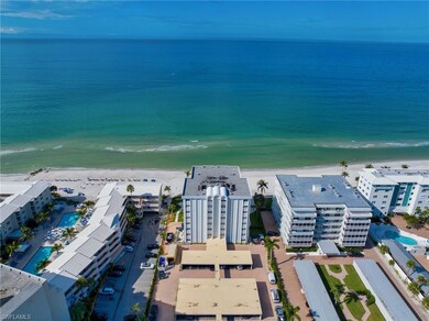 Birds eye view of property with a water view and a