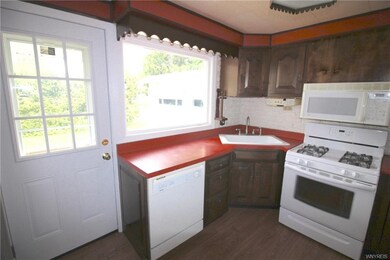 New doors to kitchen, cherry cabinets, white appli