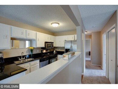 Kitchen opens to living room and dining room